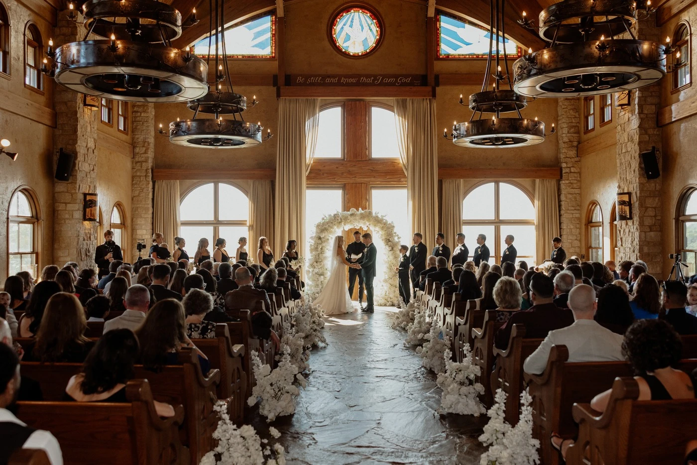 Ceremony beneath the chapel's stained glass at Top of the Rock