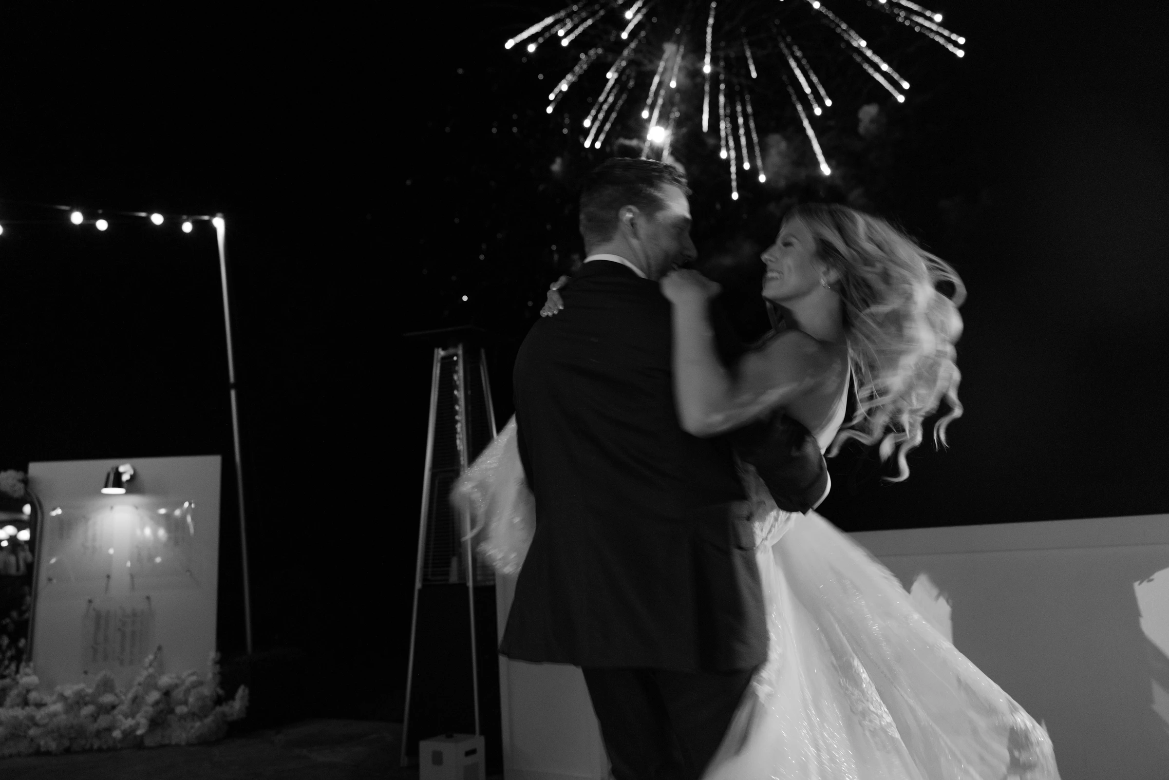 Hunter and Nataly dancing beneath fireworks at Top of the Rock, Missouri, black and white
