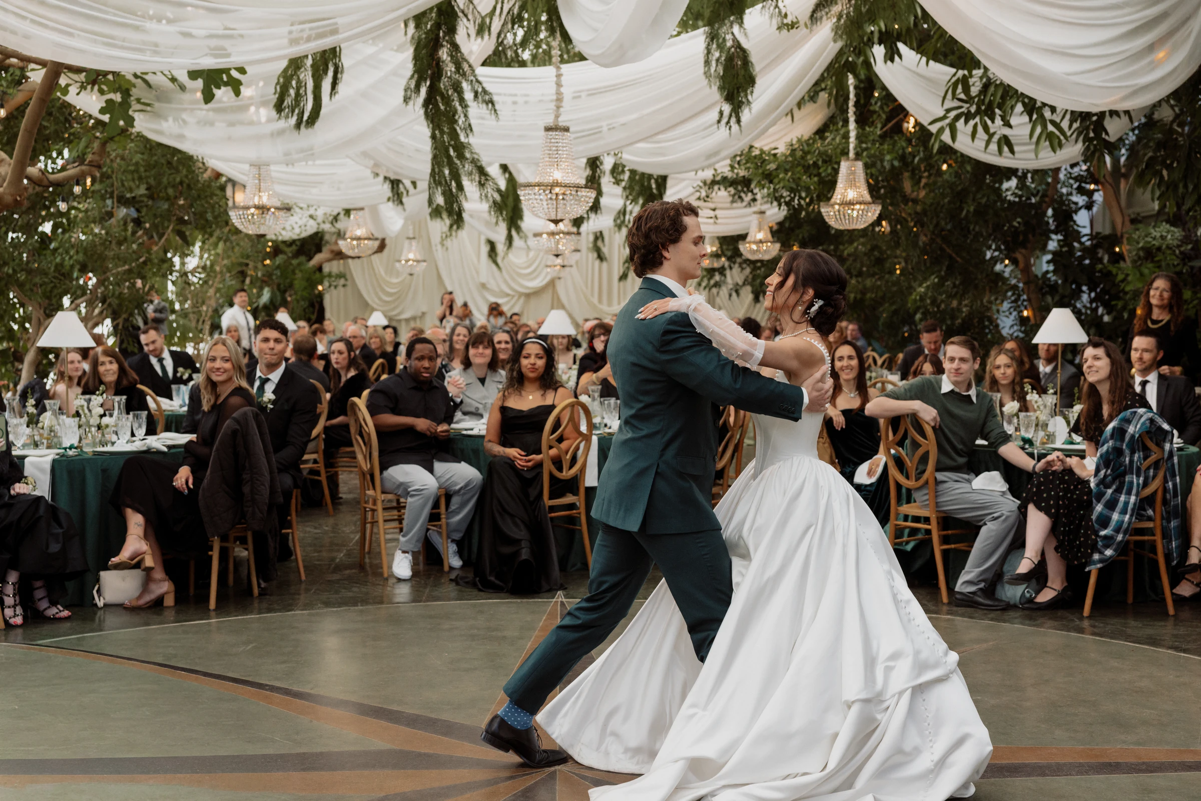 James and Tasia's first dance beneath the drapes and chandeliers at La Caille