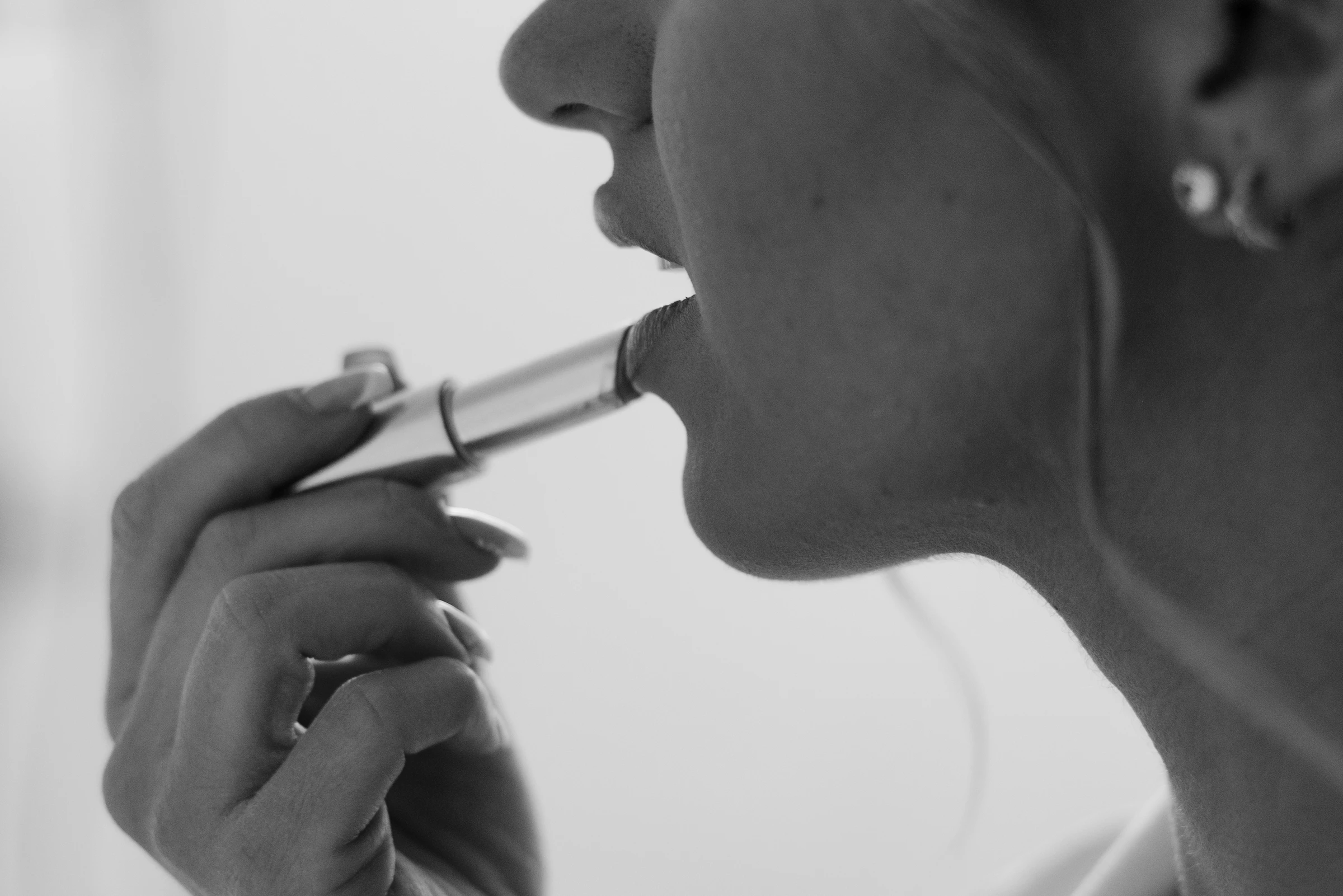 Lipstick detail while Meghan gets ready, in black and white