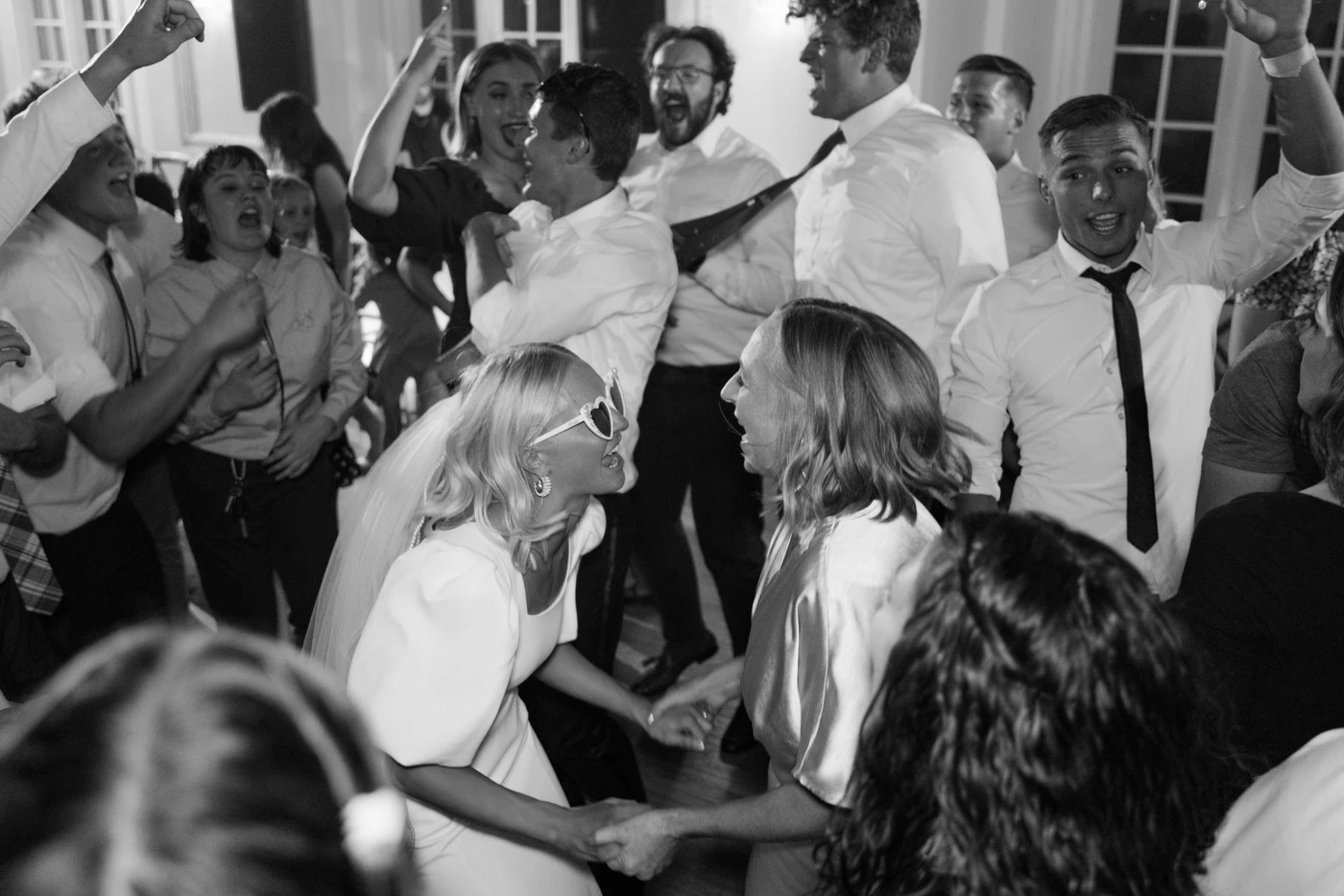 Mom leading the dance floor, black and white